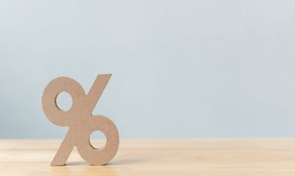 Percentage sign symbol icon wooden on wood table with white background