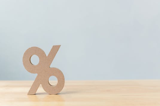 Percentage sign symbol icon wooden on wood table with white background